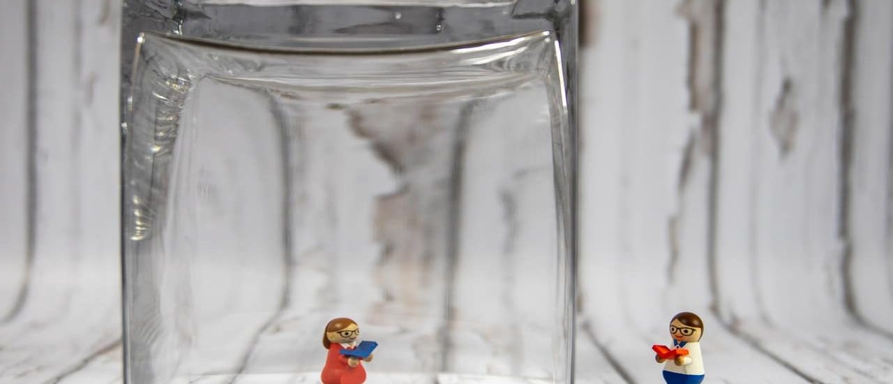 A toy in a glass jar representing a person with multiple chemical sensitivities